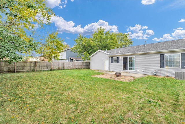 rear view of property featuring a patio area and a yard