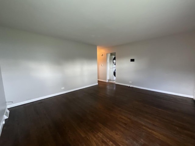 spare room featuring dark hardwood / wood-style flooring