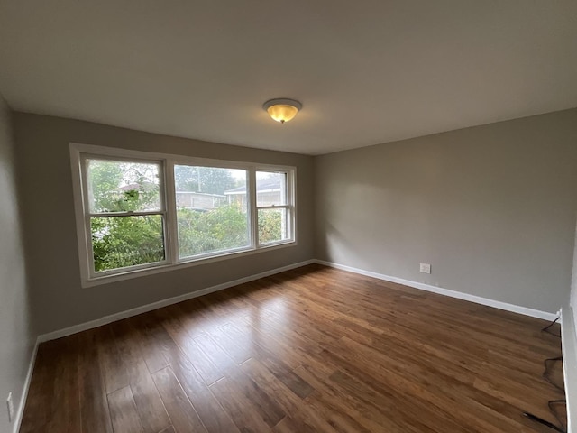 spare room featuring dark hardwood / wood-style floors