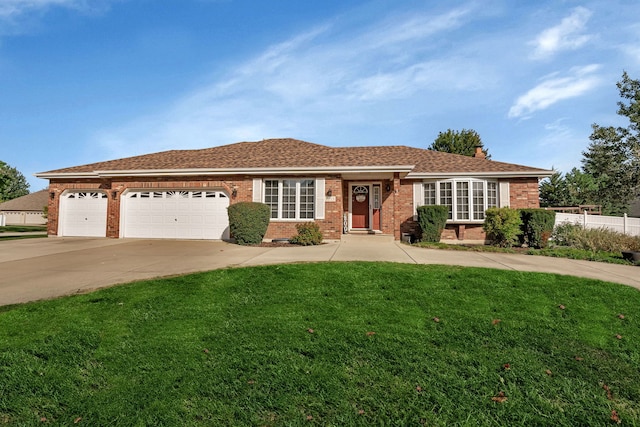 ranch-style home featuring a front yard and a garage