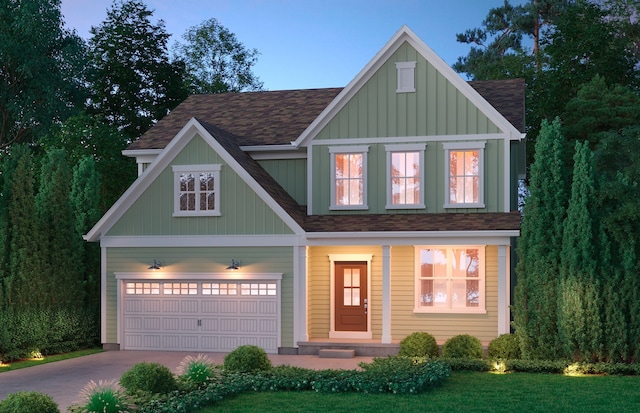 craftsman-style home with covered porch, a front yard, and a garage