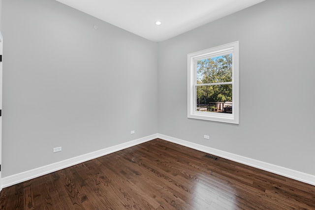 unfurnished room with hardwood / wood-style flooring