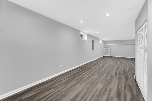 basement with hardwood / wood-style flooring