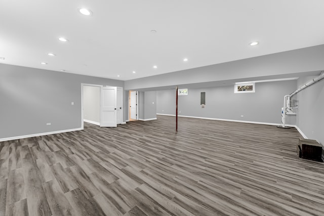 basement with hardwood / wood-style flooring