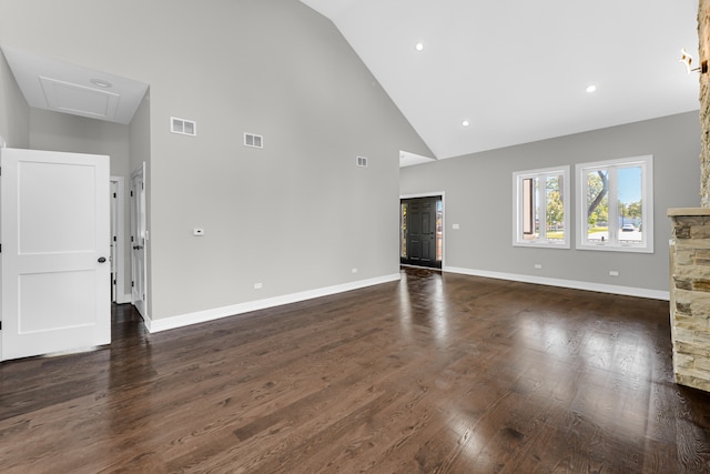 unfurnished living room featuring dark hardwood / wood-style floors and high vaulted ceiling