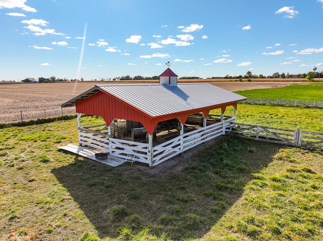 view of outdoor structure featuring an outdoor structure, an exterior structure, and a rural view