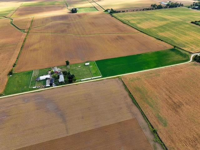 birds eye view of property featuring a rural view