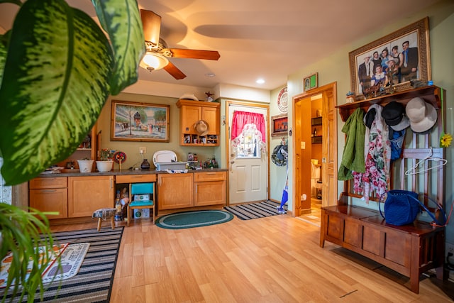 interior space with a ceiling fan, recessed lighting, and light wood finished floors