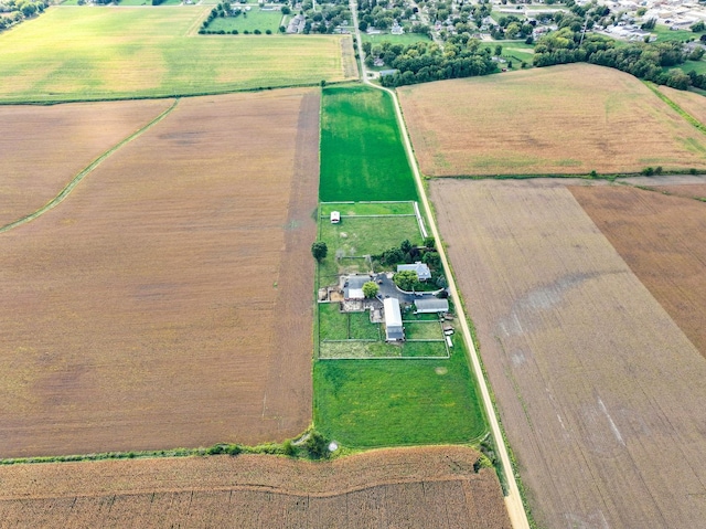 birds eye view of property with a rural view