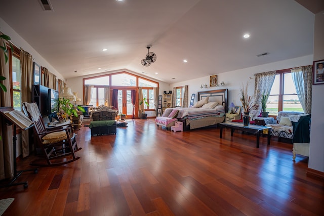 bedroom with vaulted ceiling, french doors, wood finished floors, and visible vents