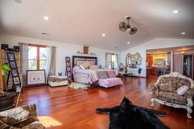 bedroom with lofted ceiling, wood finished floors, and recessed lighting