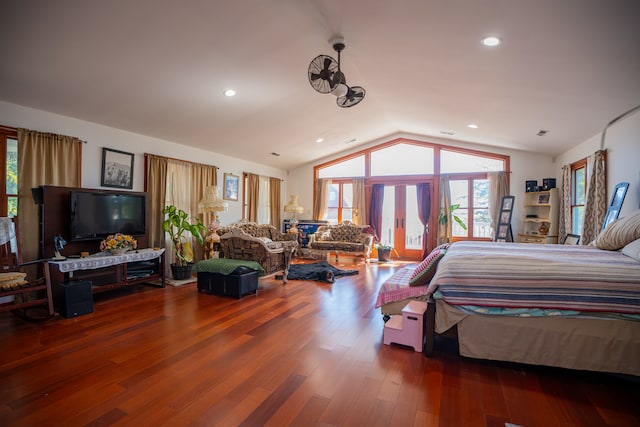 bedroom with french doors, recessed lighting, vaulted ceiling, wood finished floors, and access to outside