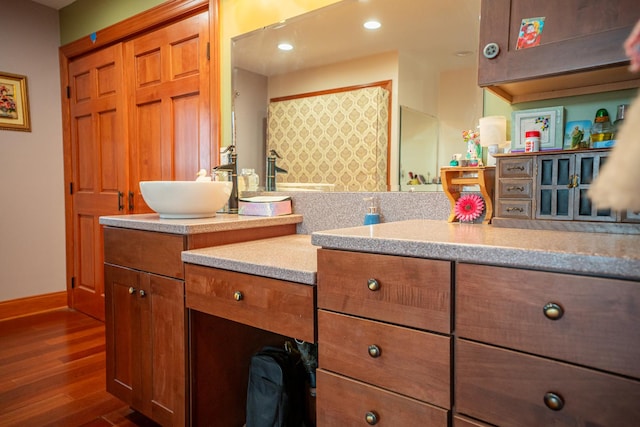 11971 W E Rd, Forreston, IL 61030 - bathroom featuring wood finished floors, vanity, recessed lighting, and baseboards