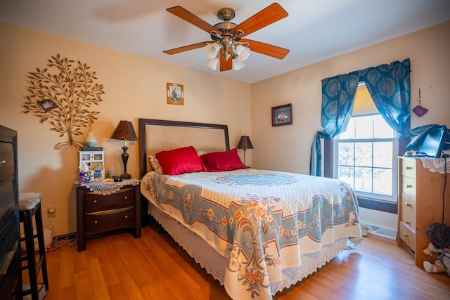 11971 W E Rd, Forreston, IL 61030 - bedroom featuring wood finished floors, baseboards, and ceiling fan