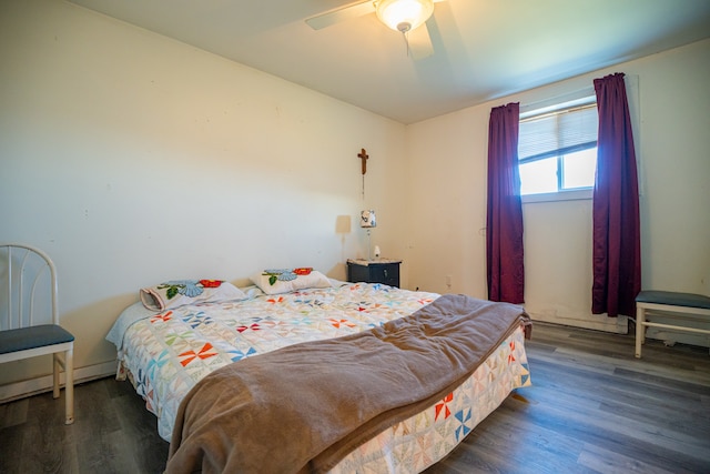 bedroom with a ceiling fan and wood finished floors