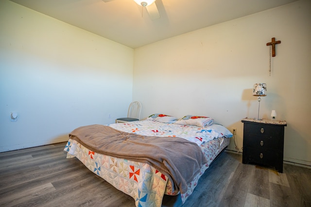 bedroom with a ceiling fan and wood finished floors