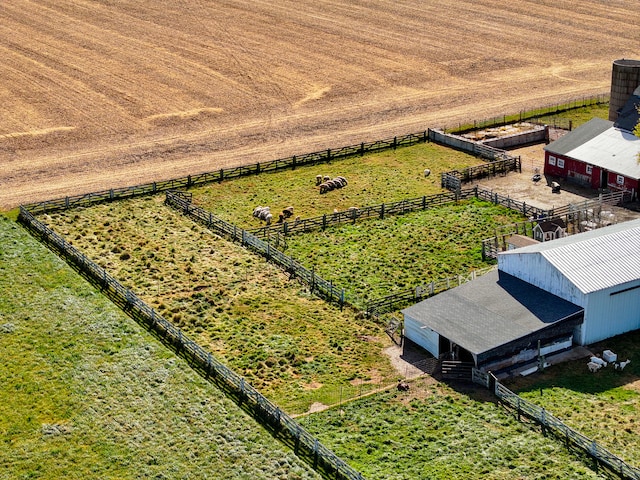 birds eye view of property featuring a rural view