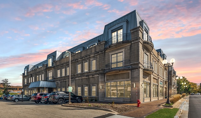 view of outdoor building at dusk