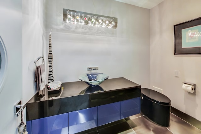 bathroom with vanity, toilet, and tile patterned floors