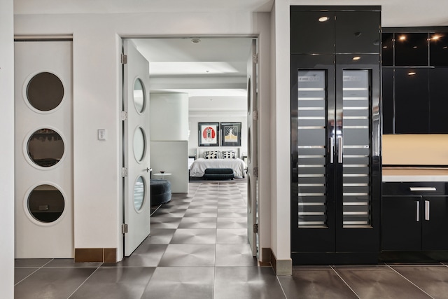 kitchen featuring stacked washer and dryer