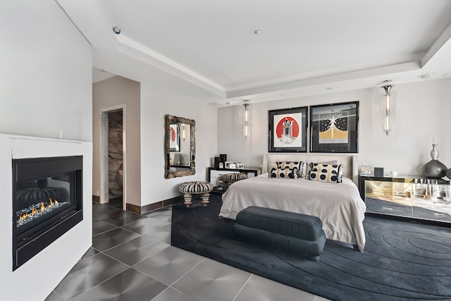 bedroom featuring a raised ceiling