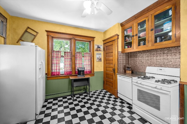 kitchen featuring a baseboard radiator, ceiling fan, white appliances, and decorative backsplash