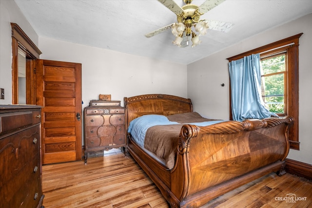 bedroom featuring ceiling fan and light hardwood / wood-style floors