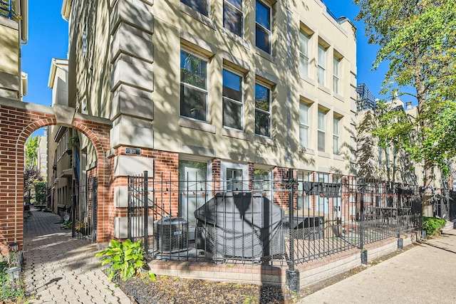 view of property featuring central AC unit