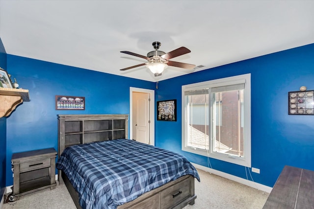 bedroom featuring ceiling fan and light colored carpet