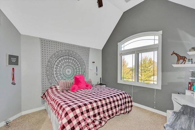 bedroom with ceiling fan, light colored carpet, and vaulted ceiling