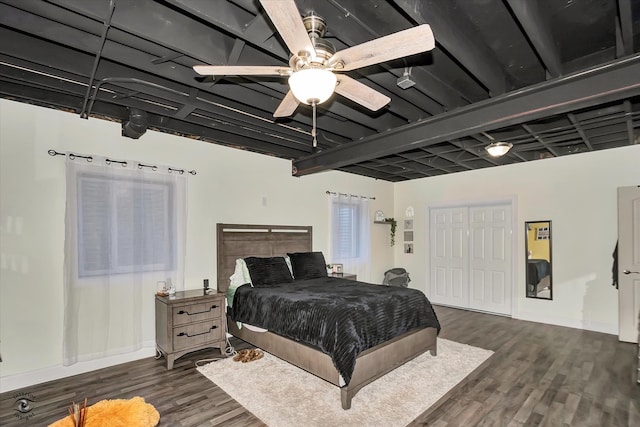 bedroom with ceiling fan and dark hardwood / wood-style floors