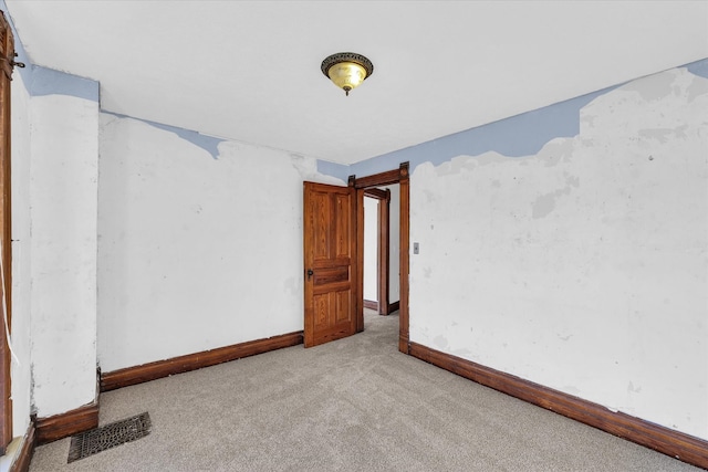 spare room with light colored carpet