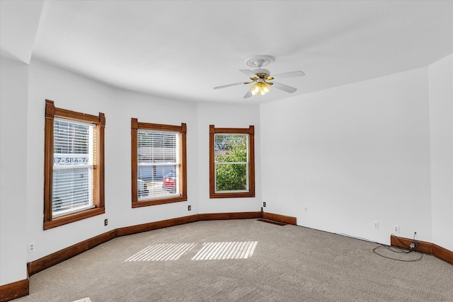 carpeted empty room with ceiling fan