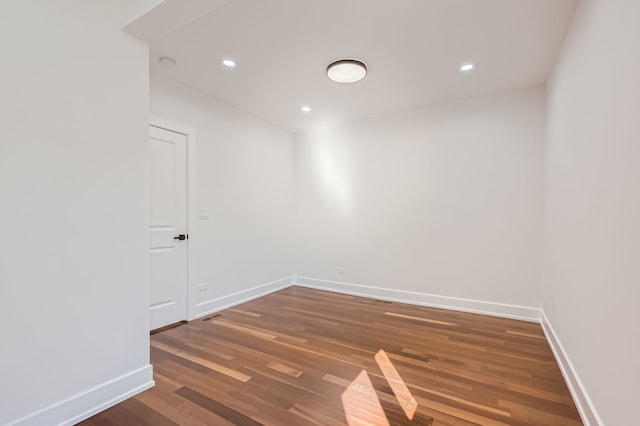 spare room featuring dark hardwood / wood-style flooring