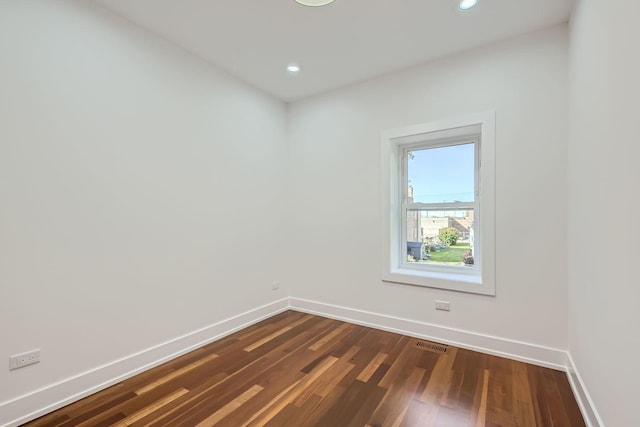 8513 S Maryland Ave, Chicago, IL 60619 - spare room with dark wood-style flooring, visible vents, baseboards, and recessed lighting