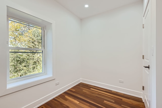 spare room featuring dark hardwood / wood-style floors