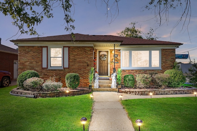 view of front of home with a lawn