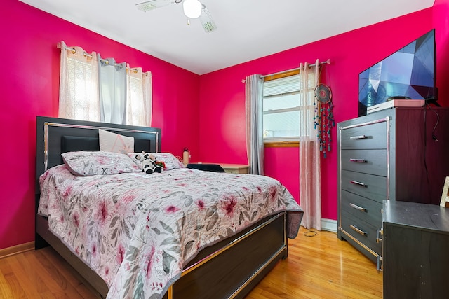 bedroom featuring ceiling fan and light hardwood / wood-style floors