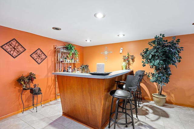 bar with light tile patterned flooring