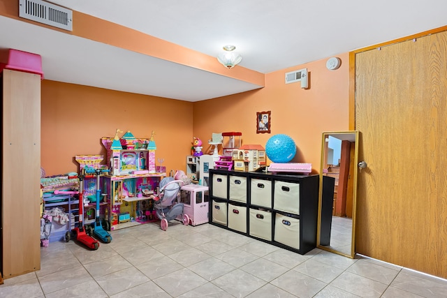 game room featuring light tile patterned floors