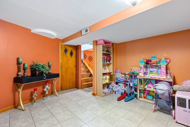 playroom featuring light tile patterned floors