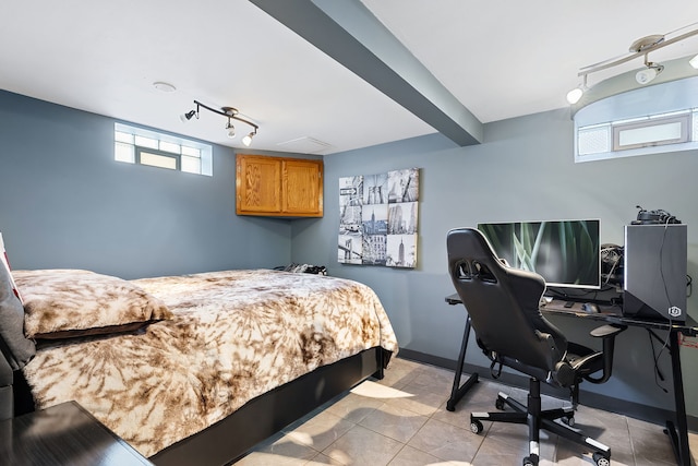 tiled bedroom featuring rail lighting