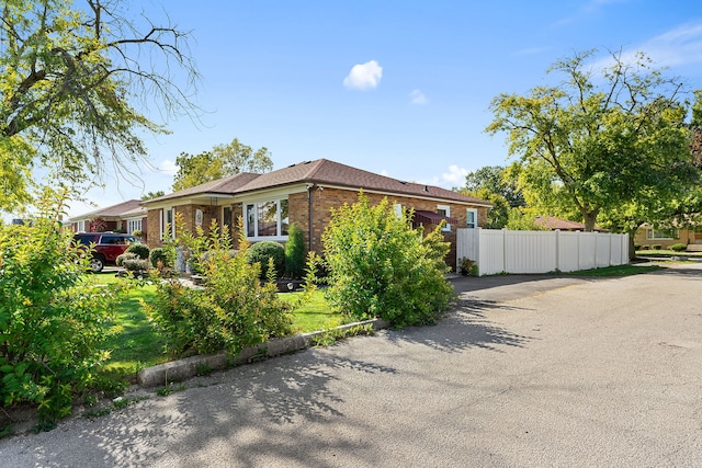 view of side of home featuring a yard