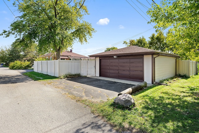 garage with a yard