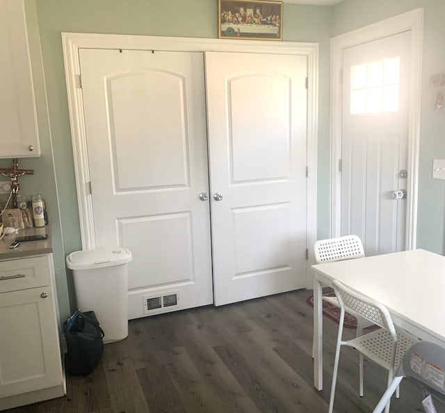 interior space with dark wood-type flooring