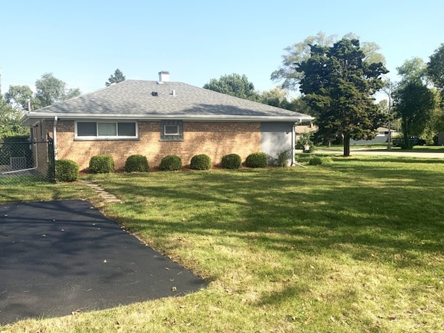 view of home's exterior featuring a lawn