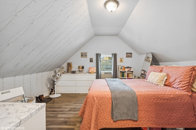 bedroom with dark wood-type flooring and lofted ceiling