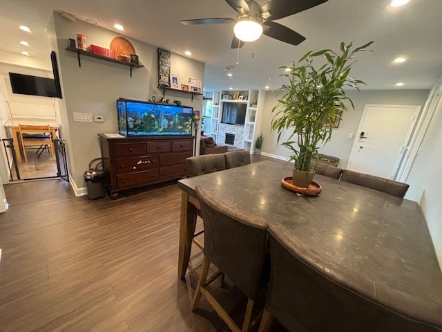 dining room with hardwood / wood-style floors and ceiling fan