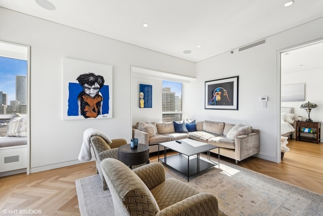 living room featuring light parquet floors