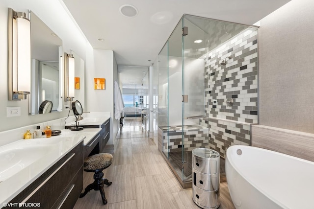800 N Michigan Ave Unit 4001, Chicago, IL 60611 - ensuite bathroom featuring vanity, a stall shower, a freestanding tub, and floor to ceiling windows